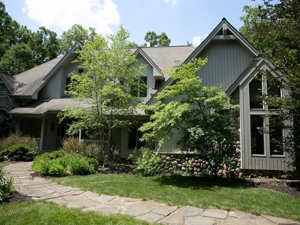 A house in Ann Arbor that needs its wood exterior stained