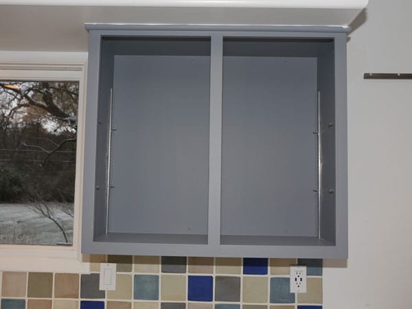 Satin paint sheen used for gray kitchen cabinets