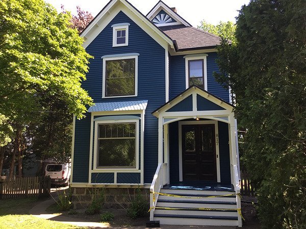 Front of a two story blue house
