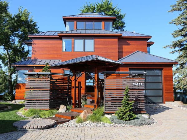 Front of house after applying maintenance coat to wood exterior siding