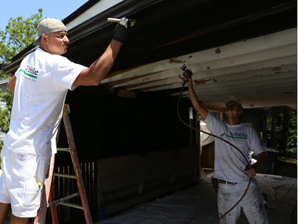 Spraying and brushing a house carport