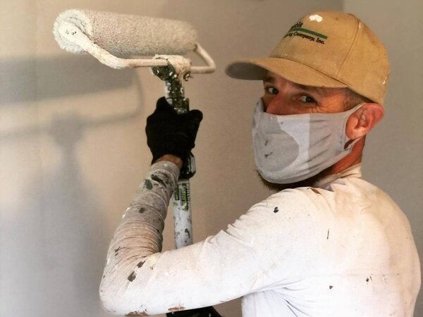 Painting an interior wall with a roller