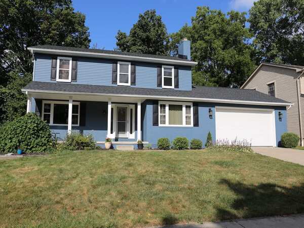 Light blue house with two types of siding