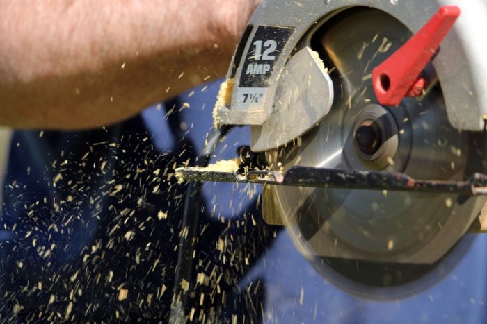 Miter saw being used to cut wood