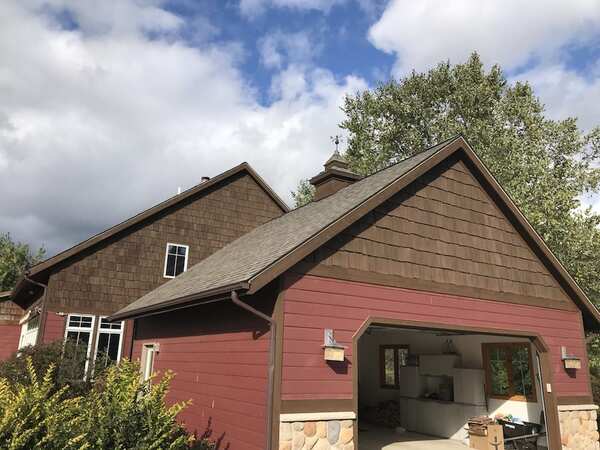 Red and wood stained house exterior