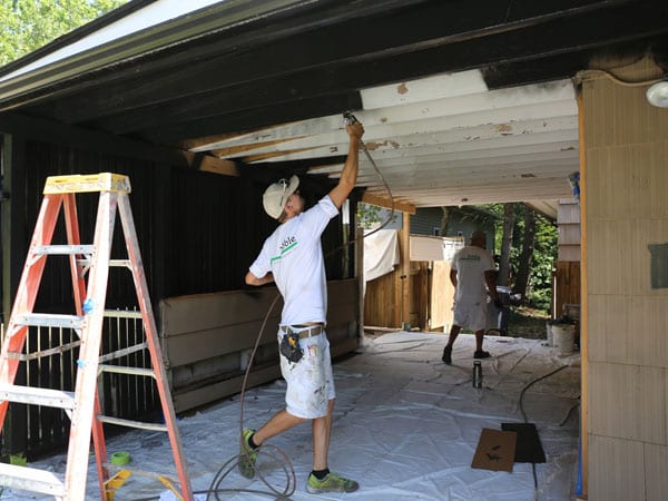 Spray paint wood exterior carport in Ann Arbor