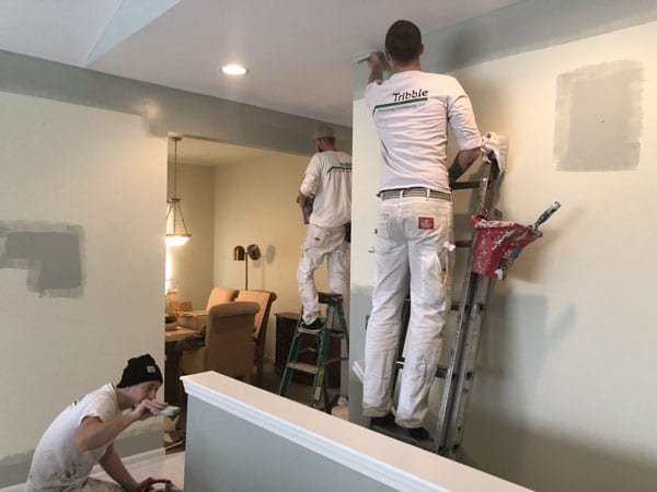 Three man painting team painting an interior