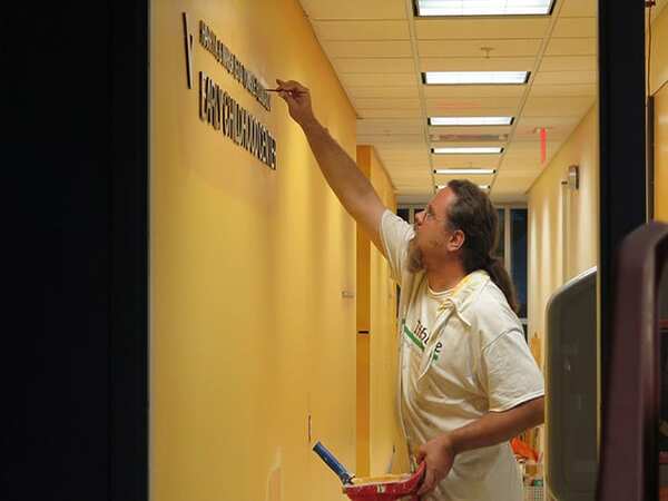 Tribble painting working on a commerical building interior
