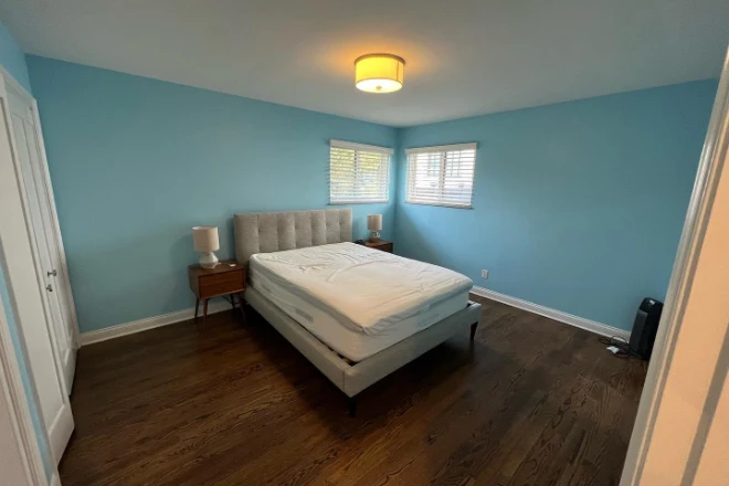 A bedroom painted with high quality blue paint.