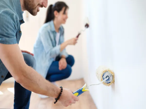 A couple DIYing interior painting