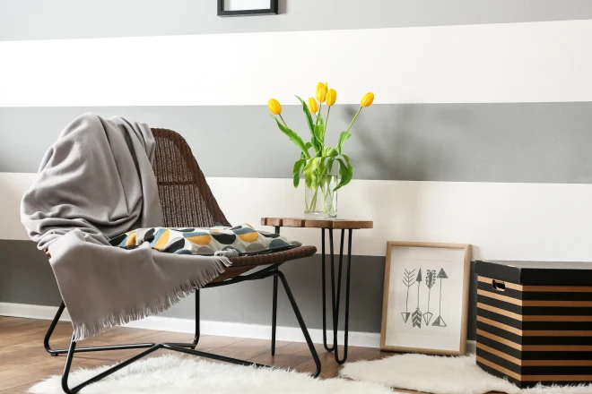 A living room with an accent wall behind the couch
