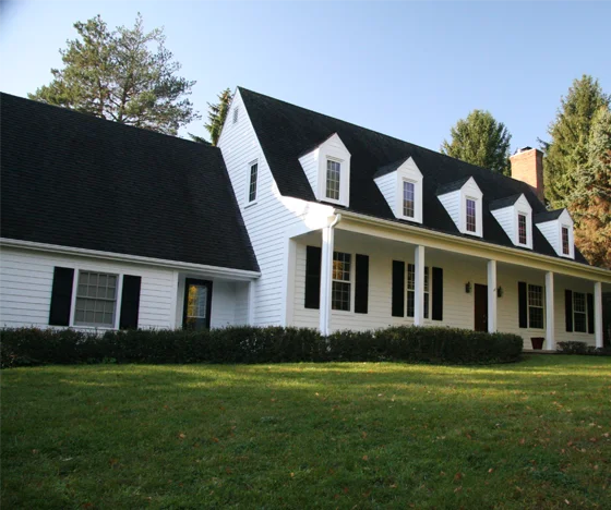 freshly painted white house with black shutters