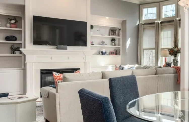 Living room with vaulted ceilings and built in bookcases