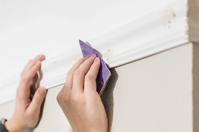 Caucasian male hand sanding