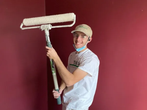 Tribble employee painting a wall