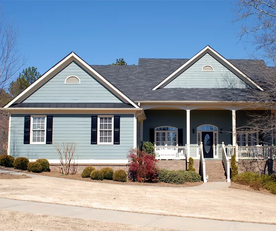 2 story home painted blue with black shutters