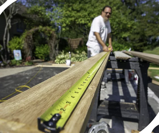 Tribble Employee Cutting Wood