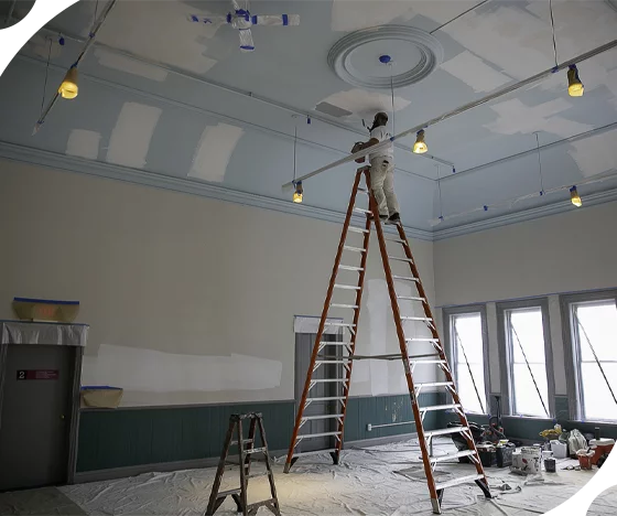 Tribble Team Painting a Commercial Building