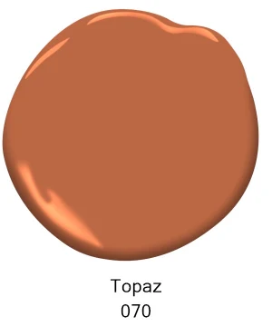 A paint swatch of a warm, medium brown color labeled Topaz 070, ideal for interior painting projects in Southeast Michigan homes. Tribble Painting recommends this inviting shade for residents of Ann Arbor, Ypsilanti, Novi, and surrounding areas looking to refresh their living spaces with expert craftsmanship. by Tribble Painting