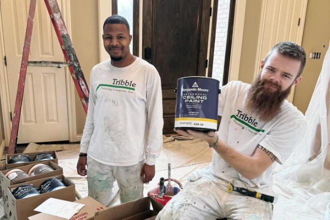 Two Tribble Painting Company pros preparing for an interior painting project